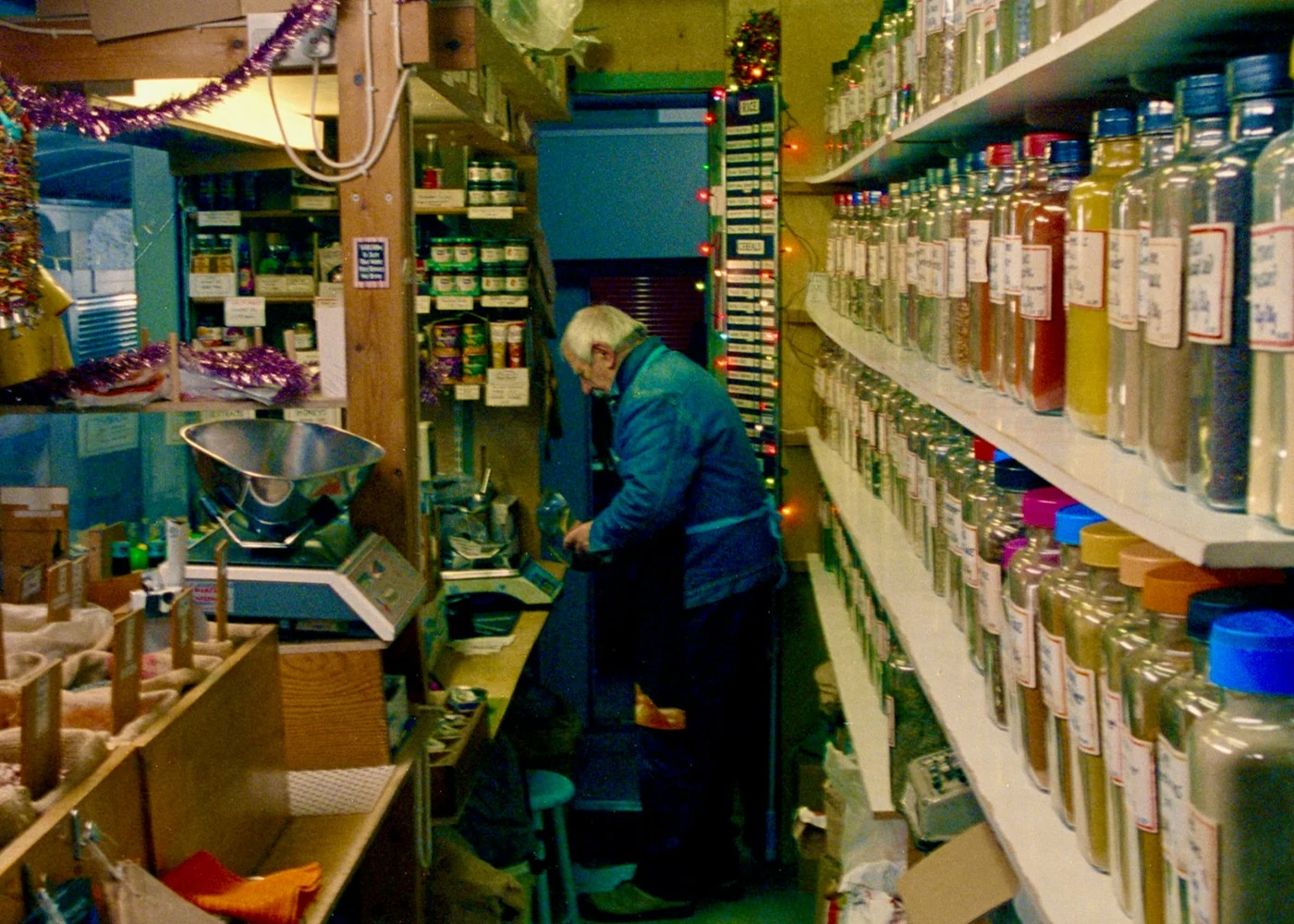 Illustrative herbal apothecary interior; not a photo of Serenity + Scott.